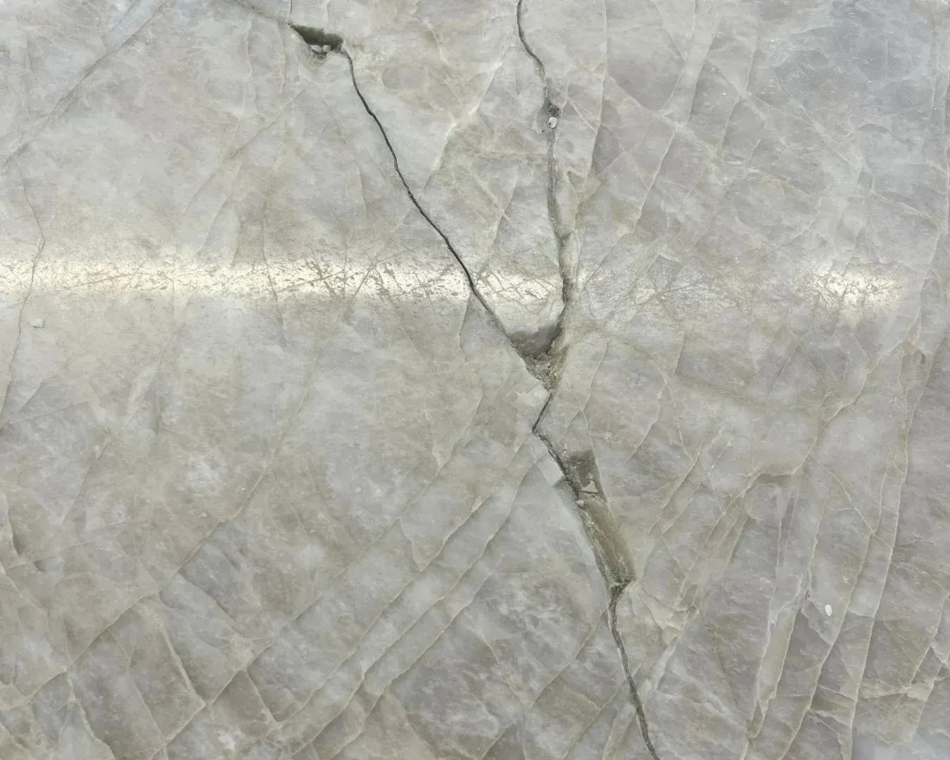 Crack across a natural stone surface before repair