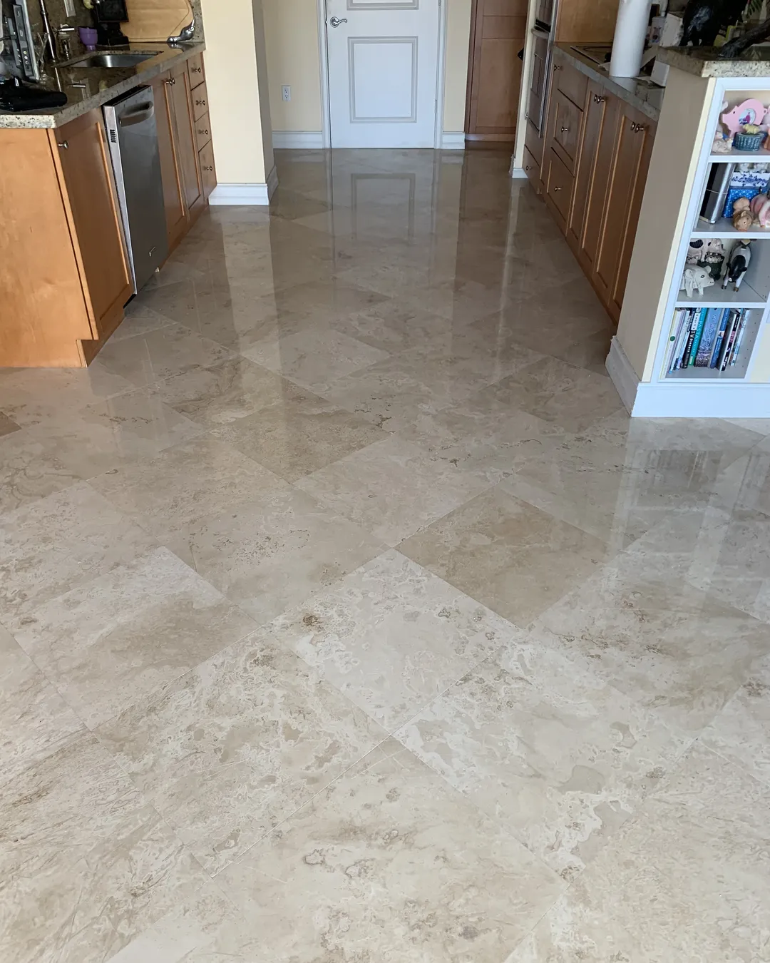 Travertine kitchen floor after restoration and polishing